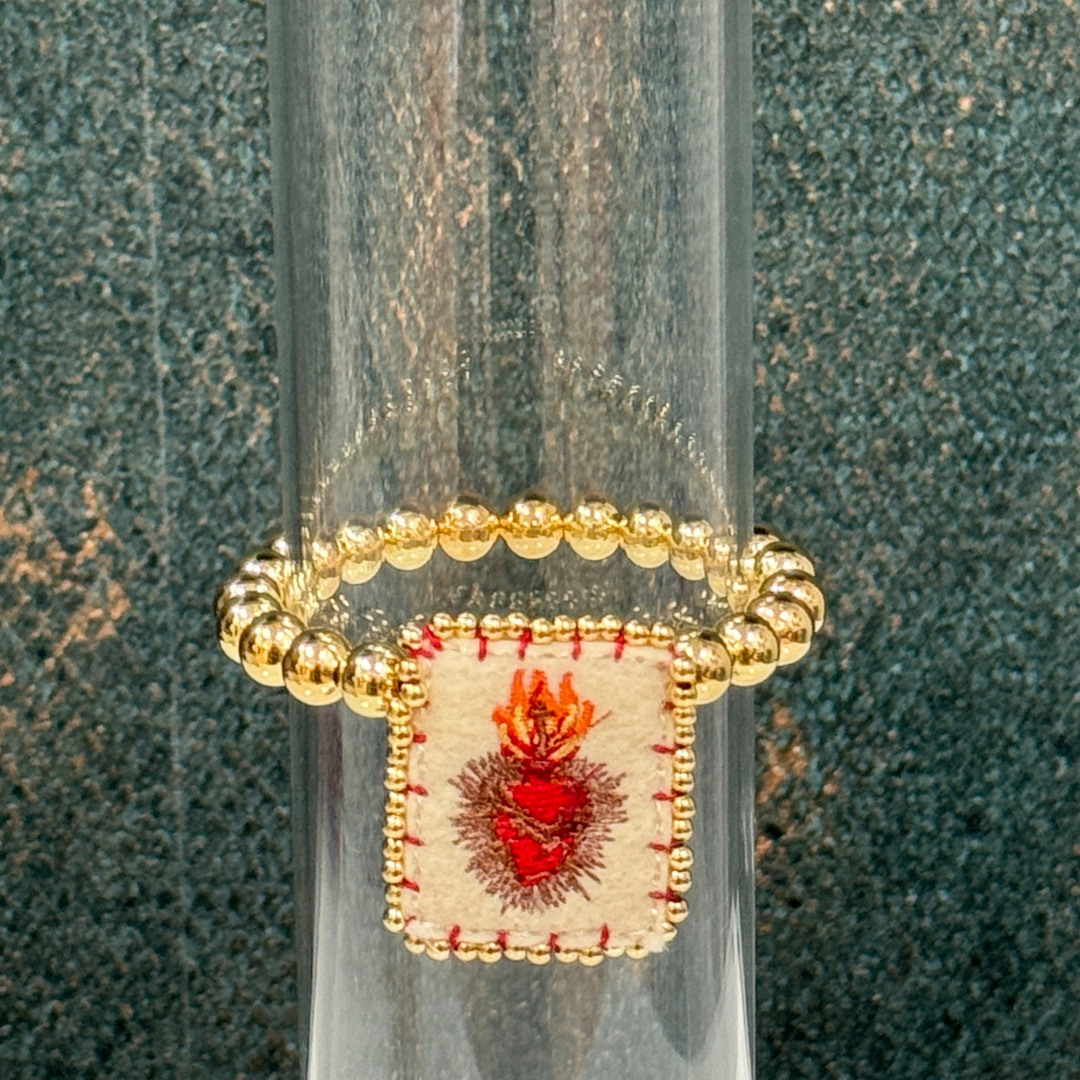 Pulsera de balines doradas con sagrado corazón