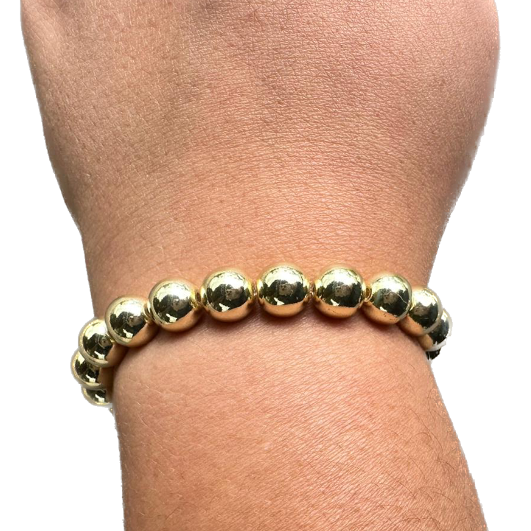 Pulsera de cuentas doradas gruesas