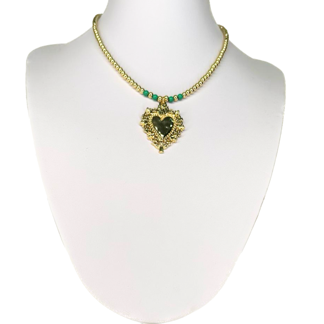 Necklace with a heart and small golden beads