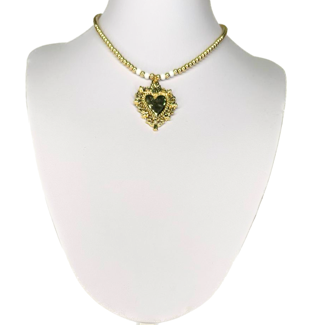 Necklace with a heart and small golden beads