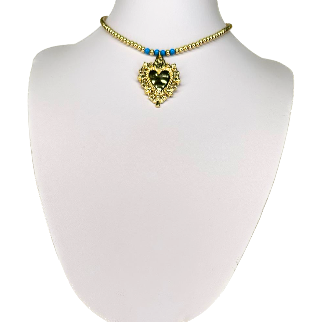 Necklace with a heart and small golden beads