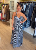 Woman wearing Tiff printed halter neck maxi dress PS Showroom