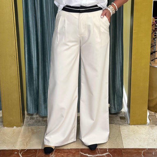Beige trousers with black waistband