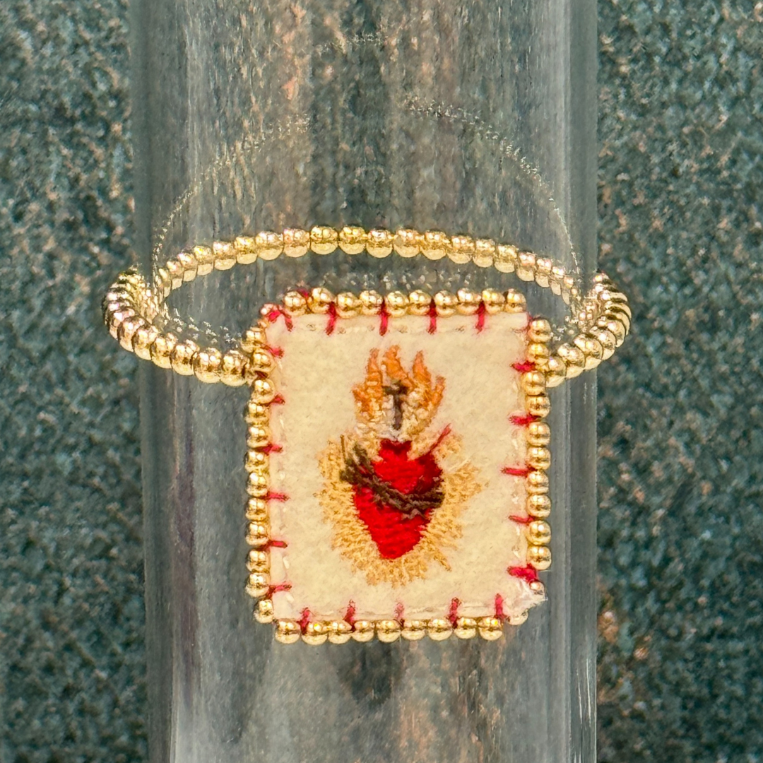 Golden ball bracelet with sacred heart