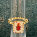 Pulsera de balines doradas con sagrado corazón