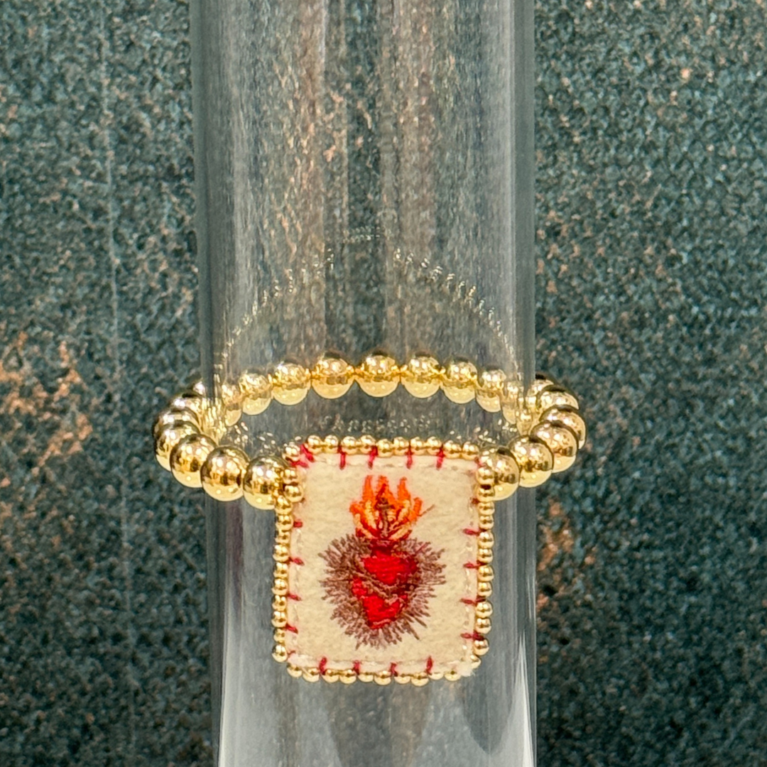 Golden ball bracelet with sacred heart